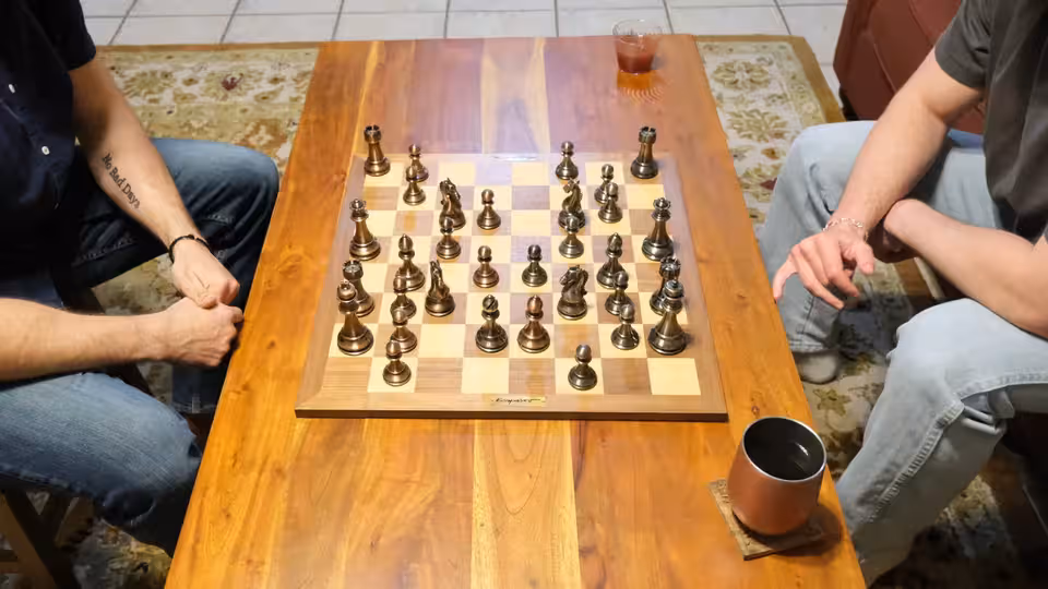 Chess pieces on a board during an in-person social event